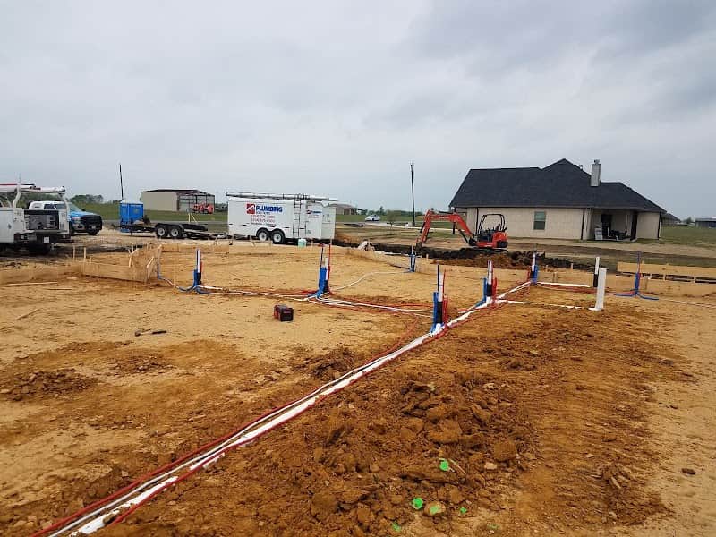 Licensed plumber performing sewer line inspection