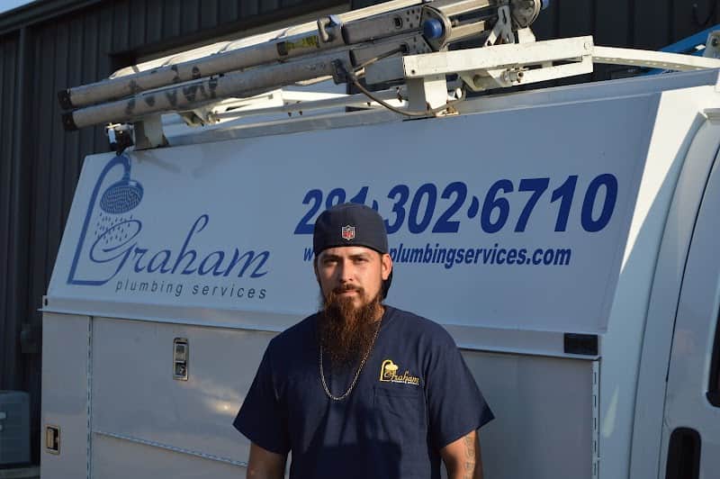 Licensed plumber performing sewer line inspection