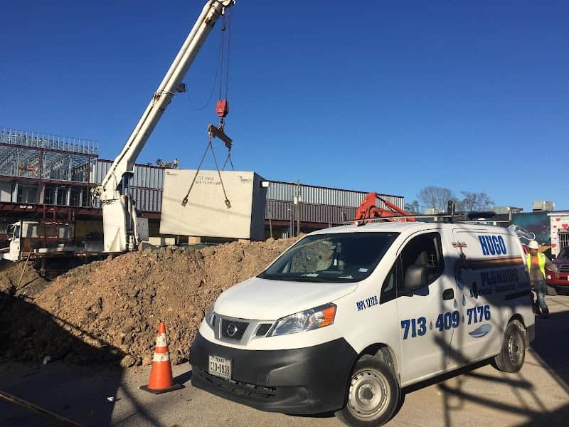 Licensed plumber performing sewer line inspection