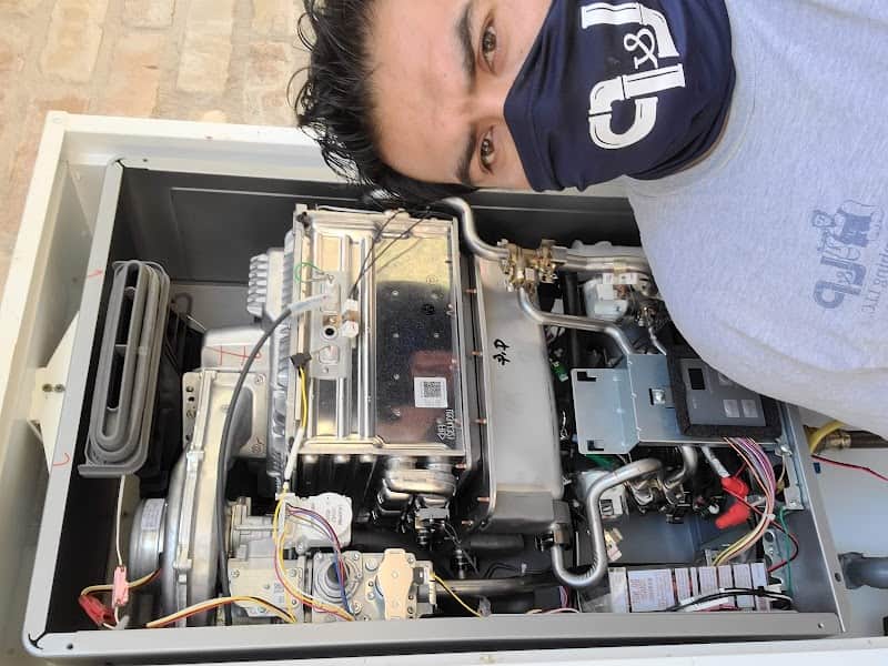 Licensed plumber performing sewer line inspection