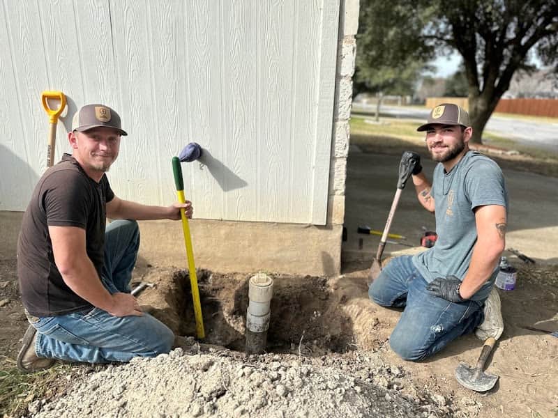 Plumbing team on residential job site