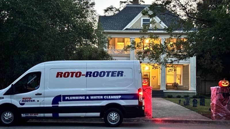 Licensed plumber performing sewer line inspection