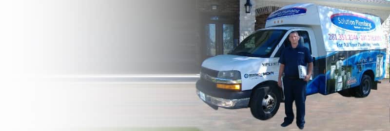 Licensed plumber performing sewer line inspection