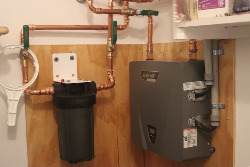 Licensed plumber performing sewer line inspection