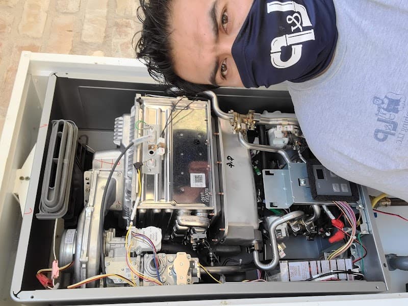 Licensed plumber performing sewer line inspection