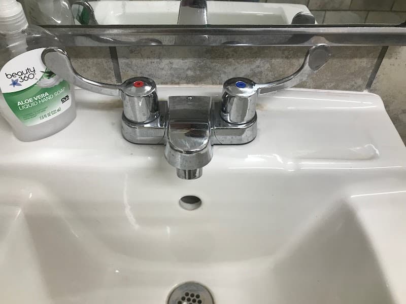 Licensed plumber performing sewer line inspection